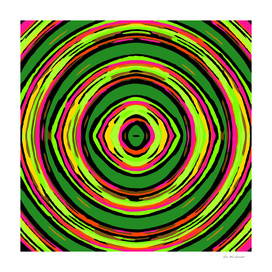 psychedelic graffiti circle pattern in green pink and yellow