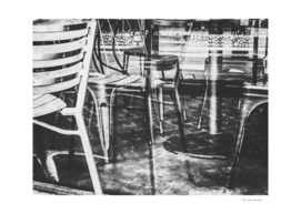 outdoor chairs in the city in black and white