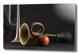Two trumpets and an apple