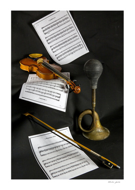 Violin, sheet music and trumpet