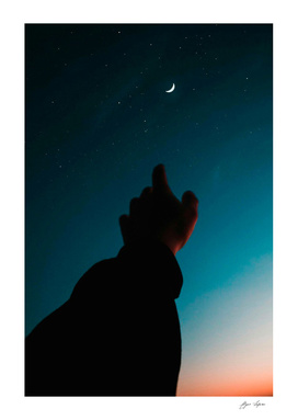 Finger point to moon