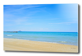 Sandy beach and blue Mediterranean sea