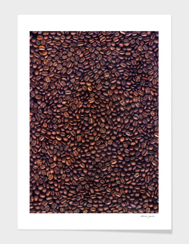 Background of grains of roasted coffee close-up