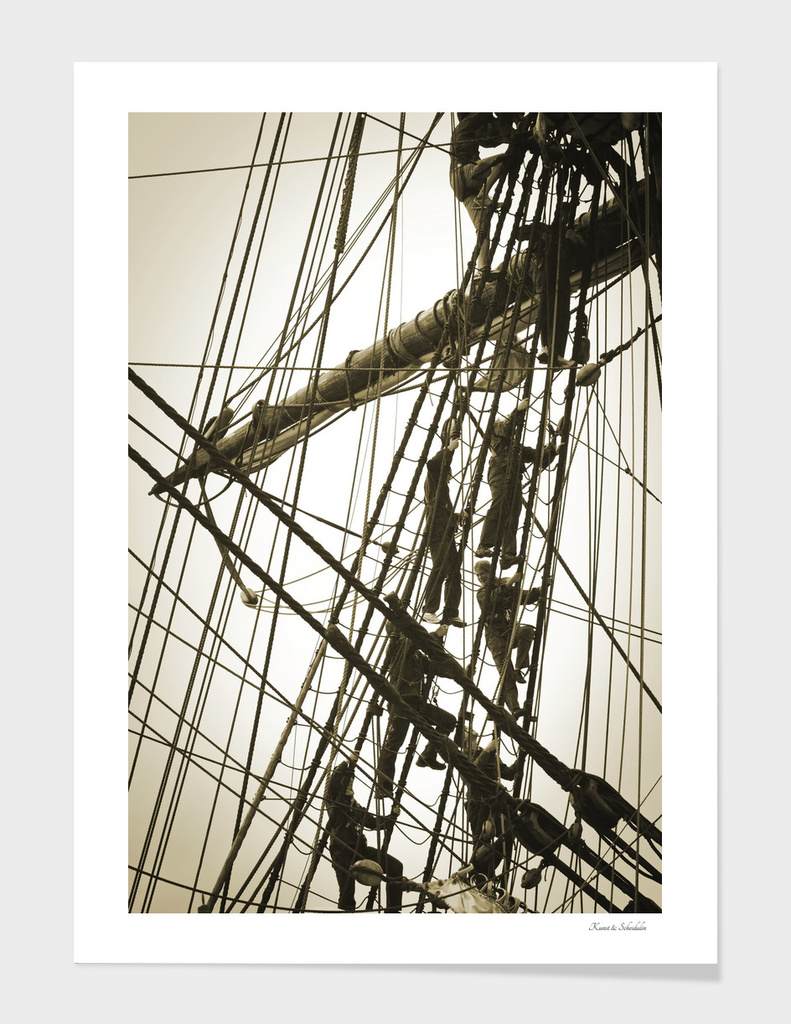 Sailors climbing in the rigging of a tall ship