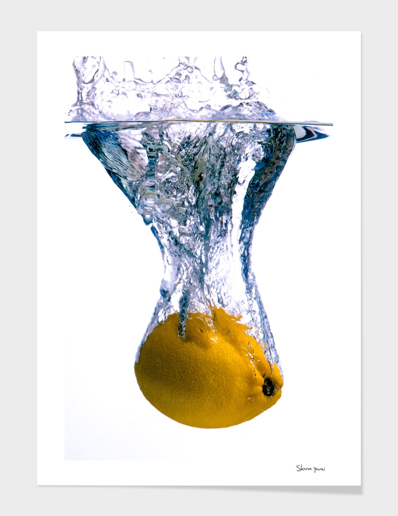Lemon falls into water with big splash on white background