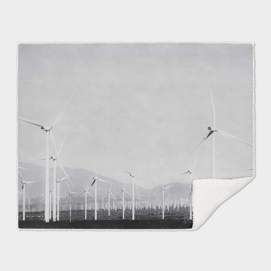 wind turbine in the desert in black and white