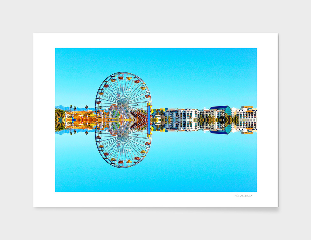reflection of the ferris wheel with buildings and blue sky