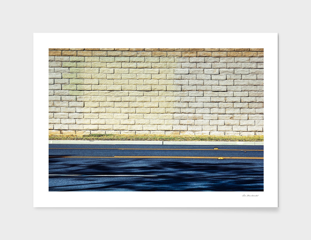 road in the city with brick wall background